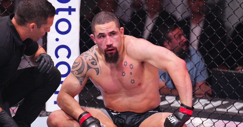 Robert Whittaker facing a jaw injury, highlighting resilience and recovery in UFC career